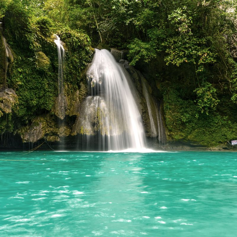 Kawasan Falls cascading into a turquoise pool in Badian, Cebu.